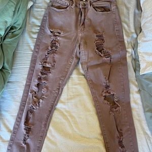 Distressed high waisted light purple jeans slightly cropped